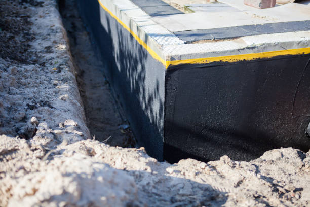 Professional Basement Waterproofing technician working in Union City, NJ